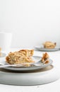 Vertical shot of a piece of crispy pie in a plate on the table