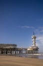 Vertical shot of the Pier Scheveningen in the Netherlands under a blue sky Royalty Free Stock Photo