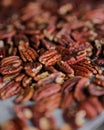 Vertical shot of a pile of tasty pecans on a table