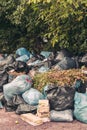 Vertical shot of a pile of trash bags - pollution concept Royalty Free Stock Photo