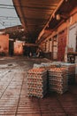 Vertical shot of piles of eggs in cartons put outdoors in front of a market Royalty Free Stock Photo