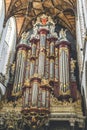 Vertical shot of pipe organ in the Grote Kerk in Haarlem, Netherland Royalty Free Stock Photo