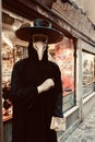 Vertical shot of the plague doctor on a street in Venice, Italy