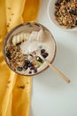 Vertical shot of a plate coconut plate with a tasty smoothie bowl.