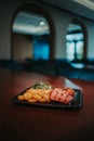 Vertical shot of a plate with grilled meat, potatoes, and vegetables Royalty Free Stock Photo