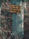 Vertical shot of a plate with Ruined area, danger of collapse, entry prohibited` text` Royalty Free Stock Photo