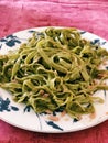 Vertical shot of a plate of Spinach pasta