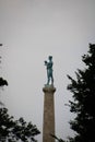 Vertical shot of the Pobednik monument in Belgrade with a gray skyscape in the background