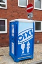 Vertical shot of a portable toilet in a blue plastic house of the company Dixi in Kiel, Germany