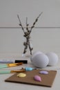 Vertical shot of a process of painting easter eggs isolated on a white background