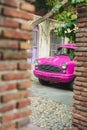 Vertical shot of a purple vintage car on the street. Gurugram, India