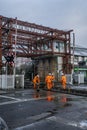 Vertical shot of railway workers working on a level crossing in Bamber Bridge, Preston Royalty Free Stock Photo