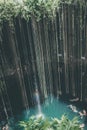Vertical shot of a rainbow in Cenote Ik Kil, Yucatan State, Mexico Royalty Free Stock Photo