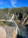 Vertical shot of a rainbow over a river in the Grand Canyon of Yellowstone Royalty Free Stock Photo