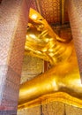 Vertical shot of the Reclining Buddha in Wat Phra Chetuphon (Wat Pho) temple Bangkok, Thailand