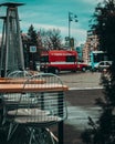 Vertical shot of a red ambulance parked in Unity Square in Bucharest taken from a cafe Royalty Free Stock Photo