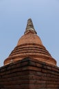 Vertical shot of red brick stone cetiya at Wat Lokayasutharam temple in Ayutthaya, Thailand