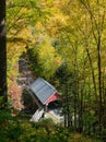 Vertical shot of a red-covered bridge in Flume Gorge Trek, Franconia Notch Park, New Hampshire Royalty Free Stock Photo