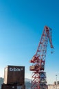 Vertical shot of the red crane Grua Carola in Bilbao, Spain