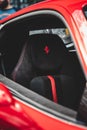 Vertical shot of a red Ferrari 488. Logo on the seat. Royalty Free Stock Photo