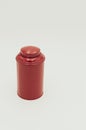Vertical shot of a red metal container on a white background Royalty Free Stock Photo