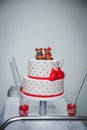 Vertical shot of red and white birthday cake with bears Royalty Free Stock Photo