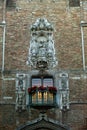 Vertical shot of the renaissance carving of the Madonna and Child on the Belfort tower in Bruges Royalty Free Stock Photo