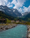 Vertical shot of a river in the countryside surrounded by a wild landscape Royalty Free Stock Photo
