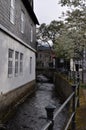 Vertical shot of river Gose or Abzucht between houses in Goslar, Germany Royalty Free Stock Photo