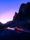 Vertical shot of the road with a passing car. Zion National Park. Utah, United States. Royalty Free Stock Photo