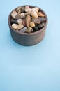 Vertical shot of rocks and pebble in a bowl Royalty Free Stock Photo