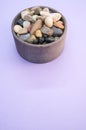 Vertical shot of rocks and pebble in a bowl Royalty Free Stock Photo