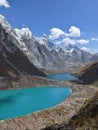 Vertical shot of the rocky Cordillera Huayhuash hiking circuit with its turqoise lakes