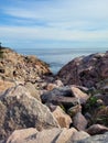 Vertical shot of the rocky shore and sea. Cape Breton Highlands, Nova Scotia, Canada. Royalty Free Stock Photo