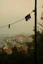 Vertical shot of a rope for hanging clothes with clothesline bans in a suburban area