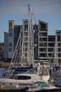 Vertical shot of row of empty docked boats at Chatham Harbor in the UK