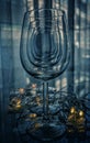 Vertical shot of a row of wine glasses on a smooth table surface with lights Royalty Free Stock Photo