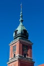 Vertical shot of the Royal castle clock tower in the historic center of Warsaw, Poland Royalty Free Stock Photo