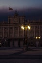 Vertical shot of The Royal Palace of Madrid surrounded by lamps at night in Spain Royalty Free Stock Photo