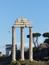 Vertical shot of the ruins of Il Tempio dei Dioscuri on blue sky background in Rome, Italy Royalty Free Stock Photo