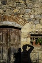 Vertical shot of a rural stone house with a wooden door in Florance, Italy