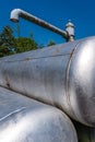 Vertical shot of rusty metal cisterns