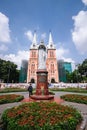 Vertical shot of the Saigon Notre Dame Cathedral with a beautiful garden in Ho Chi Minh, Vietnam Royalty Free Stock Photo