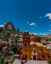 Vertical shot of the Saint Sebastian's Temple in Bernal and the Pena de Bernal monolith Royalty Free Stock Photo