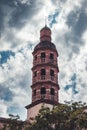 Vertical shot of Saint Sernin basilica in Toulouse with a cloudy blue sky in the background, France Royalty Free Stock Photo