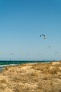 Vertical shot of sand dunes and kites at a beach in Valencia, Spain Royalty Free Stock Photo