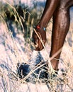 Vertical shot of a sand slipping through a hand of a black man Royalty Free Stock Photo