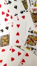 Vertical shot of the scattered deck of playing cards Royalty Free Stock Photo