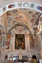 Vertical shot of the scenic interior decorations of the Sistine Chapel in Vatican