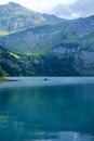 Vertical shot of a scenic view of Oeschinen lake among the mountains in Kandersteg, Switzerland